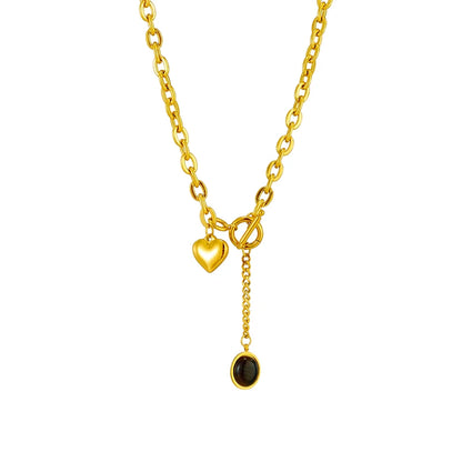 Stainless steel chain necklace featuring a heart charm and a black pendant. Perfect for layering