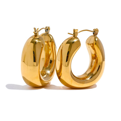 Pair of gold hoop earrings on a white background